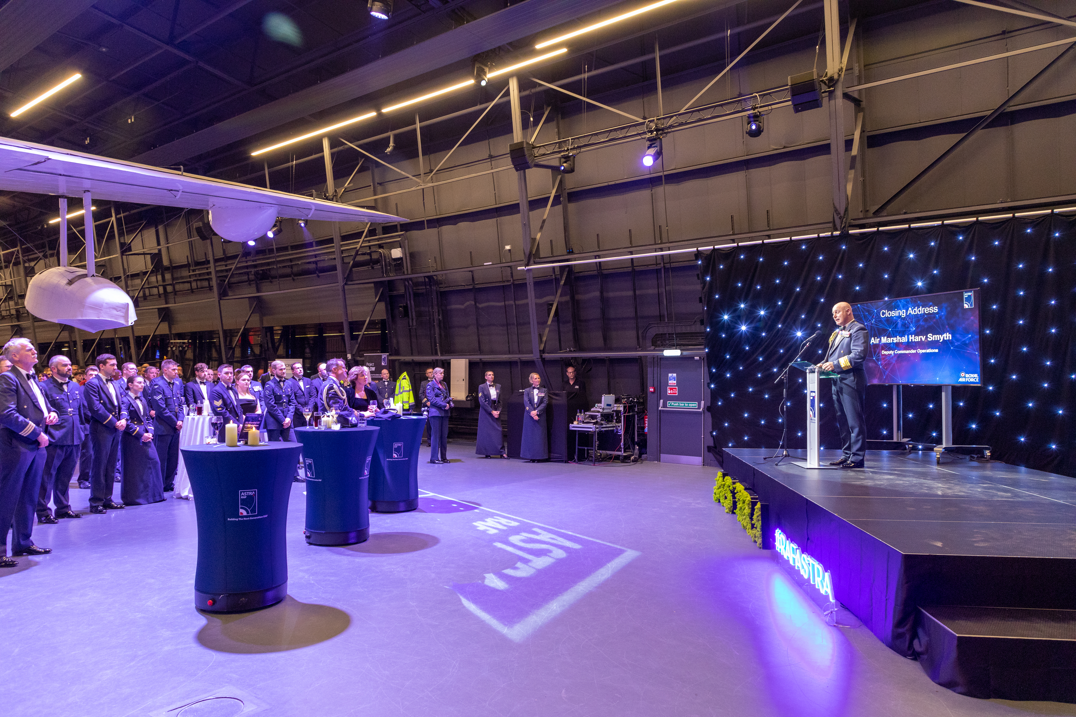 Image shows RAF personnel inside RAF Museum during awards ceremony.